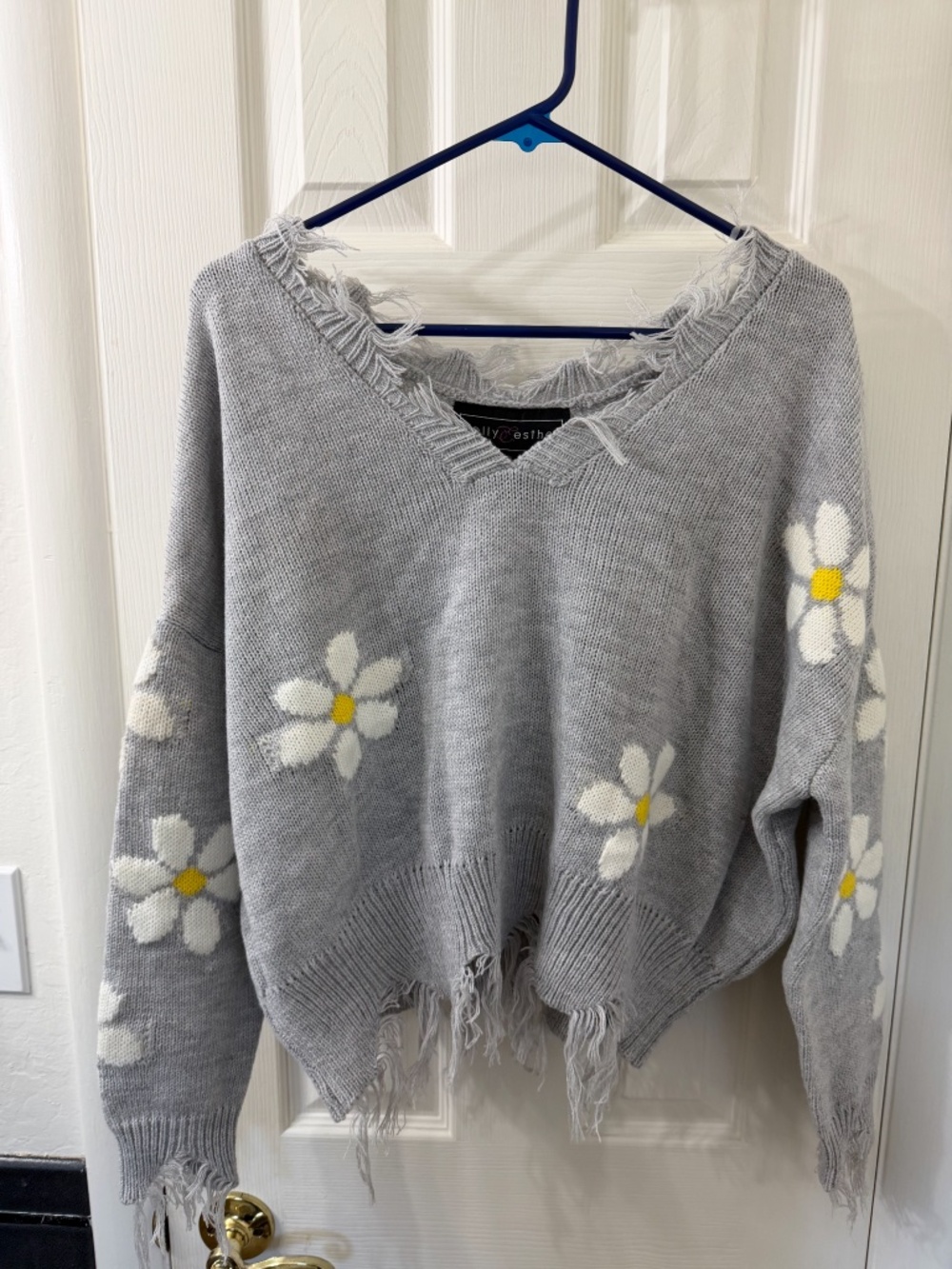 New with Tags Grey Knit Pullover Sweater with Frayed Edges. Size Medium